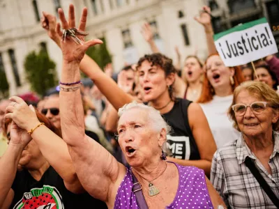 People demonstrate to demand stronger laws to protect renters in Madrid, Spain Saturday, Oct. 3, 2026. (AP Photo/Andrea Comas)