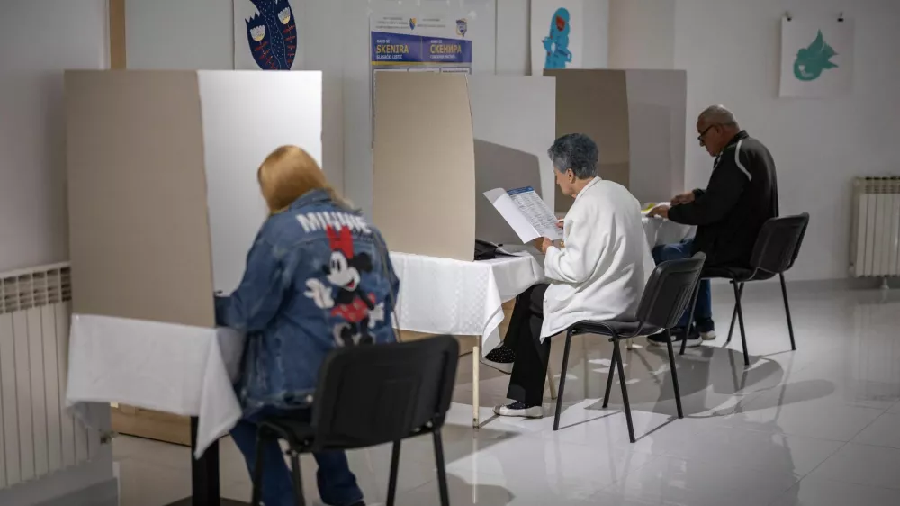 People react as they cast their ballots during Bosnia and Herzegovina's 2026 general election, in Banja Luka, Bosnia and Herzegovina, October 4, 2026. REUTERS/Marko Djurica