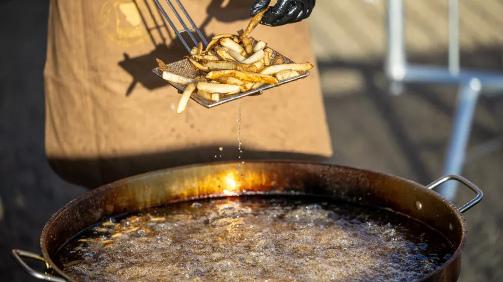 IMAGE DISTRIBUTED FOR IDAHO POTATO COMMISSION - Fresh-cut Idaho&reg; potatoes are fried onsite during an attempt by the Idaho Potato Commission and Spud Daddy to break the Guinness World Records title for the largest serving of French fries at Boise Potato Days in Boise, Idaho, on Friday, Oct. 2, 2026. (Kyle Green/AP Content Services for Idaho Potato Commission)