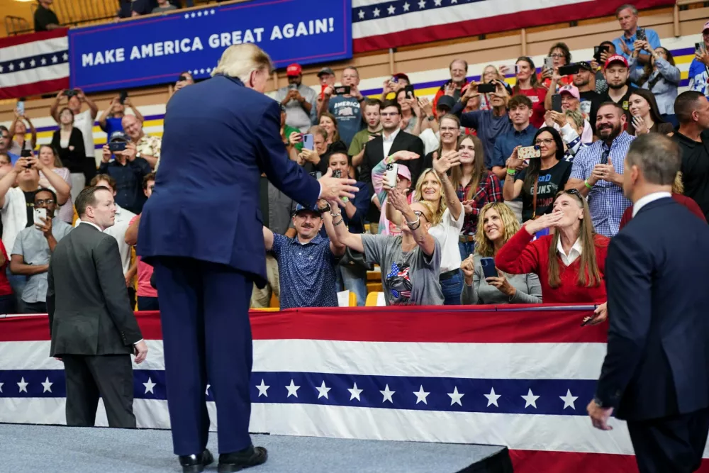 US President Donald Trump gestures as he greets supporters in the audience during a rally at Butler High School in Vandalia, Ohio, US, October 3, 2026. REUTERS/Nathan Howard