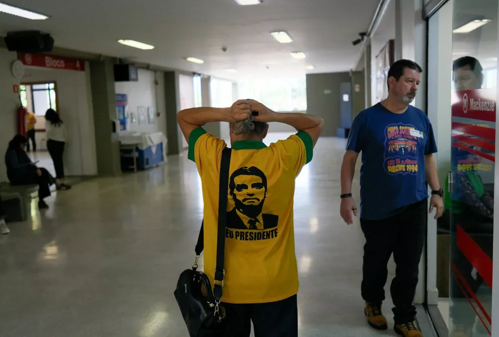 A person wears a t-shirt in support of Brazil's presidential candidate Flavio Bolsonaro of the Liberal Party (PL), during the general election, in Brasilia, Brazil, October 4, 2026. REUTERS/Diego Herculano
