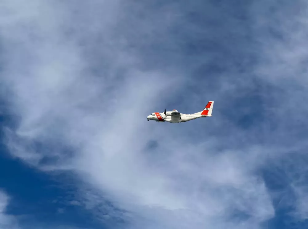 A US Coast Guard plane searches for people after it found debris from a medical transport aircraft off the shore of Massachusetts' Nantucket island, US, October 3, 2026.  US Coast Guard/Handout via REUTERS  THIS IMAGE HAS BEEN SUPPLIED BY A THIRD PARTY. MANDATORY CREDIT.