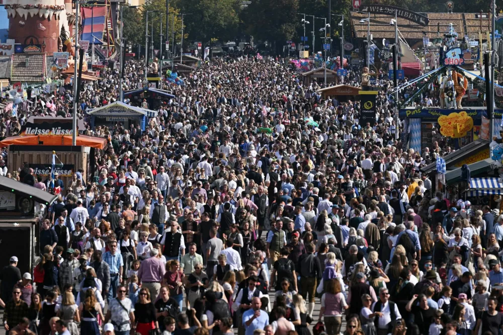 People gather on the last day of the 191st Oktoberfest, the world's largest beer festival in Munich, Germany, October 4, 2026. REUTERS/Angelika Warmuth