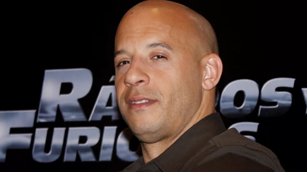U.S. actor Vin Diesel gestures as he poses for photographers during an event to promote his new film "Fast and Furious" in Mexico City, Friday, March. 27, 2009. (AP Photo/Marco Ugarte)