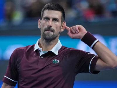 Novak Djokovic, of Serbia, reacts during play against Alex De Minaur, of Australia, during the men's singles final match at the China Open tennis tournament in Beijing, Tuesday, Oct. 6, 2026. (AP Photo/Achmad Ibrahim)