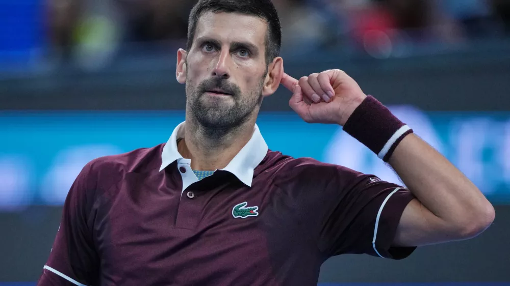 Novak Djokovic, of Serbia, reacts during play against Alex De Minaur, of Australia, during the men's singles final match at the China Open tennis tournament in Beijing, Tuesday, Oct. 6, 2026. (AP Photo/Achmad Ibrahim)
