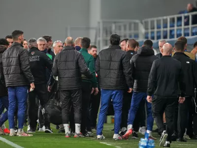 Players and coaches leave the field at half time during the UEFA Nations League soccer match between the Republic of Ireland and Israel in Backa Topola, Serbia, Sunday, Oct. 4, 2026. (AP Photo/Darko Vojinovic)