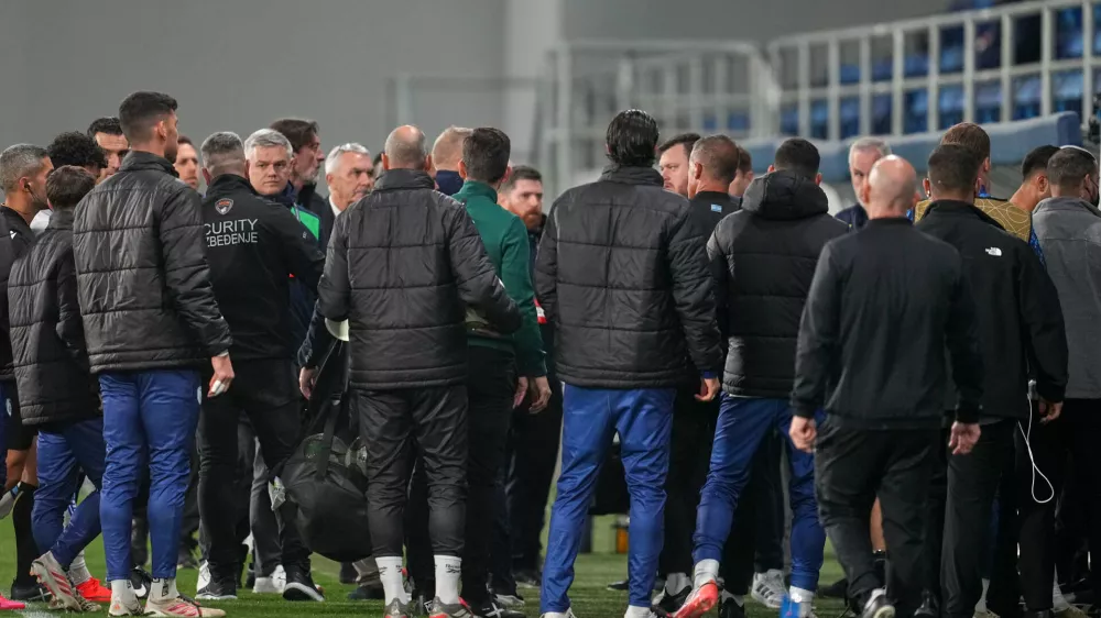 Players and coaches leave the field at half time during the UEFA Nations League soccer match between the Republic of Ireland and Israel in Backa Topola, Serbia, Sunday, Oct. 4, 2026. (AP Photo/Darko Vojinovic)