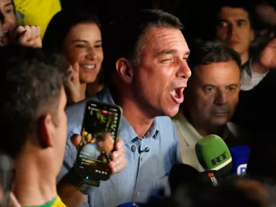Opposition presidential candidate Sen. Flavio Bolsonaro speaks after advancing to a runoff election following the first round of the presidential election in Brasilia, Brazil, Sunday, Oct. 4, 2026. (AP Photo/Eraldo Peres)