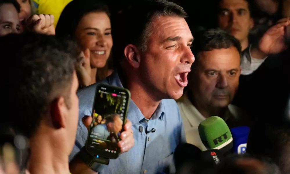 Opposition presidential candidate Sen. Flavio Bolsonaro speaks after advancing to a runoff election following the first round of the presidential election in Brasilia, Brazil, Sunday, Oct. 4, 2026. (AP Photo/Eraldo Peres)