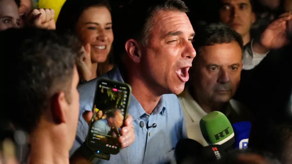Opposition presidential candidate Sen. Flavio Bolsonaro speaks after advancing to a runoff election following the first round of the presidential election in Brasilia, Brazil, Sunday, Oct. 4, 2026. (AP Photo/Eraldo Peres)