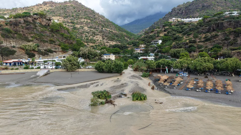 An aerial view of a flooded area near Ierapetra town, on the island of Crete, southern Greece, Saturday, Oct. 3, 2026, as severe weather causes flooding, road damage and widespread disruption across the island. (InTime News via AP)