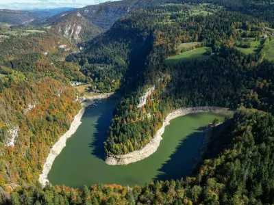 A drone view shows cruise boats at the Saut du Doubs on an autumn day, amid drought conditions on the Doubs River and Lac des Brenets, near Villers-le-Lac, France October 2, 2026. REUTERS/Denis Balibouse REFILE - CORRECTING YEAR FROM "026" TO "2026".
