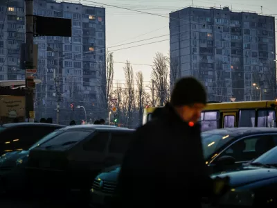 A man smokes a cigarette as he walks through a residential area on a frosty winter day, soon after an air alert ended following a Russian missile and drone attack, during a power blackout after critical civil infrastructure was hit recently, amid Russia's attack on Ukraine, in Kyiv, Ukraine January 20, 2026. REUTERS/Alina Smutko   TPX IMAGES OF THE DAY