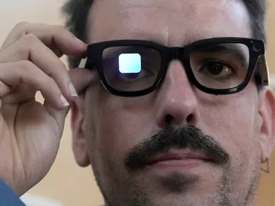 FILE - Michael Mcloughlin, of El Confidencial, gets a demonstration of Gemini on Android XR glasses at a Google I/O event in Mountain View, Calif., Tuesday, May 20, 2025. (AP Photo/Jeff Chiu, File)
