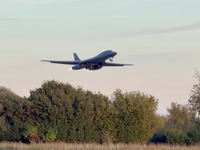 A B-1 bomber takes off from RAF Fairford airbase, as the US removes its B-1 bombers one week after several men were arrested on suspicion of offences under the Explosives Act, in this screengrab obtained from a social media video in Fairford, Gloucestershire, Britain October 4, 2026. @CraigYoungMedia via X/via REUTERS THIS IMAGE HAS BEEN SUPPLIED BY A THIRD PARTY. MANDATORY CREDIT. NO RESALES. NO ARCHIVES. Verification notes: Reuters verified the location and date when the video was recorded from the original file metadata. The trees, utility tower and terrain seen in the video matched archive and satellite imagery of the area. The model of the aircraft was verified from the design of the plane, the engines, the nose and the wings seen in the video, which matched archive imagery of the Rockwell B-1B Lancer.   TPX IMAGES OF THE DAY