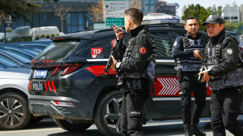 Police work at the scene, after gunfire was heard near the building housing the Israeli consulate, according to a witness, in Istanbul, Turkey, April 7, 2026. REUTERS/Murad Sezer