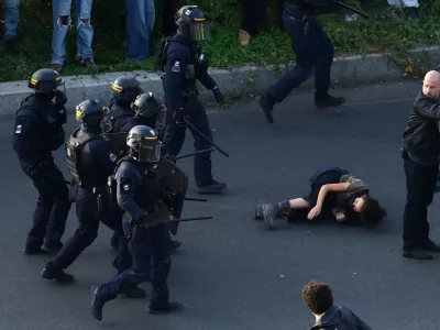 French CRS riot police charge protesters amid clashes at Place de la Nation during a demonstration by high school and university students, supported by teachers' union and school parents, in Paris as part of a nationwide day of demonstrations and blockades, voicing anger over overcrowded classrooms, teacher shortages and dilapidated school buildings, which students blame on years of underinvestment, France, October 6, 2026. REUTERS/Yves Herman   TPX IMAGES OF THE DAY