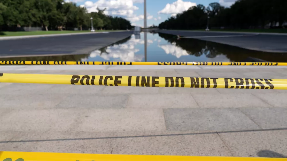 FILE - The Lincoln Memorial Reflecting Pool is seen with police line yellow tape at the National Mall, Sept. 6, 2026, in Washington. (AP Photo/Jose Luis Magana, File)