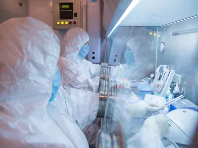 This undated photo released by the Irkutsk Anti-Plague Research Institute of Siberia and Far East, shows the institute workers in a lab. (The Irkutsk Anti-Plague Research Institute of Siberia and Far East via AP)