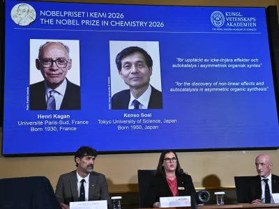 Portraits of Henri Kagan and Kenso Soai are shown on the screen as they are awarded the 2026 Nobel Prize in Chemistry, at the Royal Swedish Academy of Sciences in Stockholm, Sweden, on Oct. 7, 2026. Photo: (Fredrik Sandberg/TT News Agency via AP)