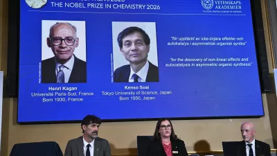 Portraits of Henri Kagan and Kenso Soai are shown on the screen as they are awarded the 2026 Nobel Prize in Chemistry, at the Royal Swedish Academy of Sciences in Stockholm, Sweden, on Oct. 7, 2026. Photo: (Fredrik Sandberg/TT News Agency via AP)