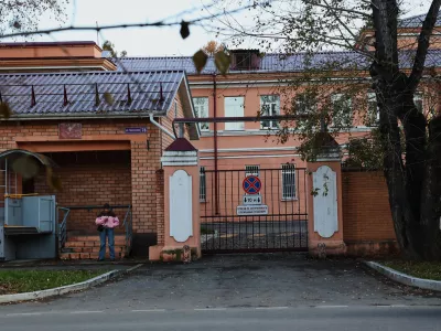 A pedestrian stands at the building of the Irkutsk Anti-Plague Research Institute of Siberia and the Far East in Irkutsk, Russi, on Wednesday, Oct. 7, 2026. (AP Photo)