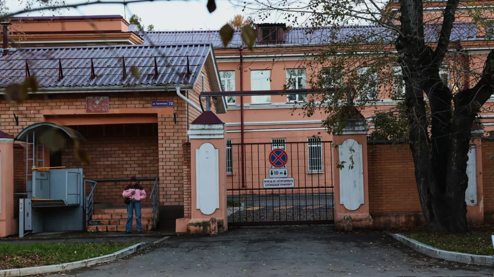 A pedestrian stands at the building of the Irkutsk Anti-Plague Research Institute of Siberia and the Far East in Irkutsk, Russi, on Wednesday, Oct. 7, 2026. (AP Photo)