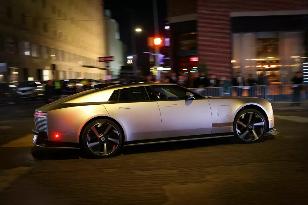 The Jaguar Type 01 all-electric four-door luxury vehicle drives on West 26th street after the model was unveiled at its world premiere event in New York City, US, October 6, 2026. REUTERS/Mike Segar