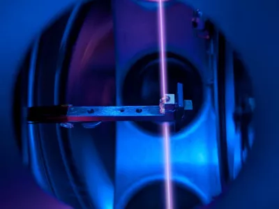A calcium fluoride crystal, in its holder, that incorporates large numbers of thorium nuclei is seen inside the vacuum system of a nuclear clock, with a laser beam probing the thorium nuclei, at a laboratory at TU Wien in Vienna, Austria, in this handout image released on October 7, 2026. T. Schumm, TU Wien/Handout via REUTERS  THIS IMAGE HAS BEEN SUPPLIED BY A THIRD PARTY. NO RESALES. NO ARCHIVES. QUALITY FROM SOURCE.