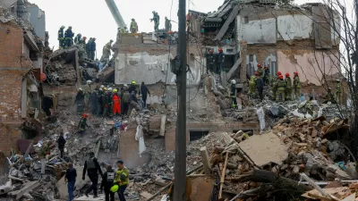 Emergency services work to rescue residents from under the debris at the site of an apartment building which was hit by a Russian missile strike in the town of Pryluky, amid Russia's attack on Ukraine, in the Chernihiv region, Ukraine, October 7, 2026. REUTERS/Valentyn Ogirenko