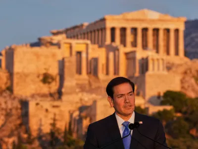 U.S. Secretary of State Marco Rubio speaks at the Pnyx hill, where ancient Athenians held democratic assemblies, with the ancient Parthenon temple atop the Acropolis in the background, in Athens,Wednesday, Oct. 7, 2026. (AP Photo/Mark Schiefelbein, Pool)