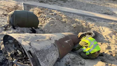 A police bomb squad member inspects an unexploded Russian missile warhead at a site of a Russian missile strike, amid Russia's attack on Ukraine, in Kyiv, Ukraine October 7, 2026. Press service of the National Police of Ukraine/Handout via REUTERS  THIS IMAGE HAS BEEN SUPPLIED BY A THIRD PARTY. DO NOT OBSCURE LOGO.