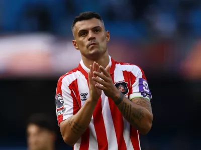 Soccer Football - Premier League - Manchester City v Sunderland - Etihad Stadium, Manchester, Britain - September 20, 2026 Sunderland's Granit Xhaka applauds fans after the match Action Images via Reuters/Lee Smith EDITORIAL USE ONLY. NO USE WITH UNAUTHORIZED AUDIO, VIDEO, DATA, FIXTURE LISTS, CLUB/LEAGUE LOGOS OR 'LIVE' SERVICES. ONLINE IN-MATCH USE LIMITED TO 120 IMAGES, NO VIDEO EMULATION. NO USE IN BETTING, GAMES OR SINGLE CLUB/LEAGUE/PLAYER PUBLICATIONS. PLEASE CONTACT YOUR ACCOUNT REPRESENTATIVE FOR FURTHER DETAILS..
