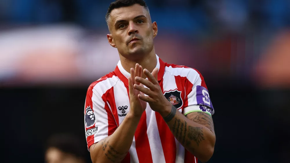 Soccer Football - Premier League - Manchester City v Sunderland - Etihad Stadium, Manchester, Britain - September 20, 2026 Sunderland's Granit Xhaka applauds fans after the match Action Images via Reuters/Lee Smith EDITORIAL USE ONLY. NO USE WITH UNAUTHORIZED AUDIO, VIDEO, DATA, FIXTURE LISTS, CLUB/LEAGUE LOGOS OR 'LIVE' SERVICES. ONLINE IN-MATCH USE LIMITED TO 120 IMAGES, NO VIDEO EMULATION. NO USE IN BETTING, GAMES OR SINGLE CLUB/LEAGUE/PLAYER PUBLICATIONS. PLEASE CONTACT YOUR ACCOUNT REPRESENTATIVE FOR FURTHER DETAILS..