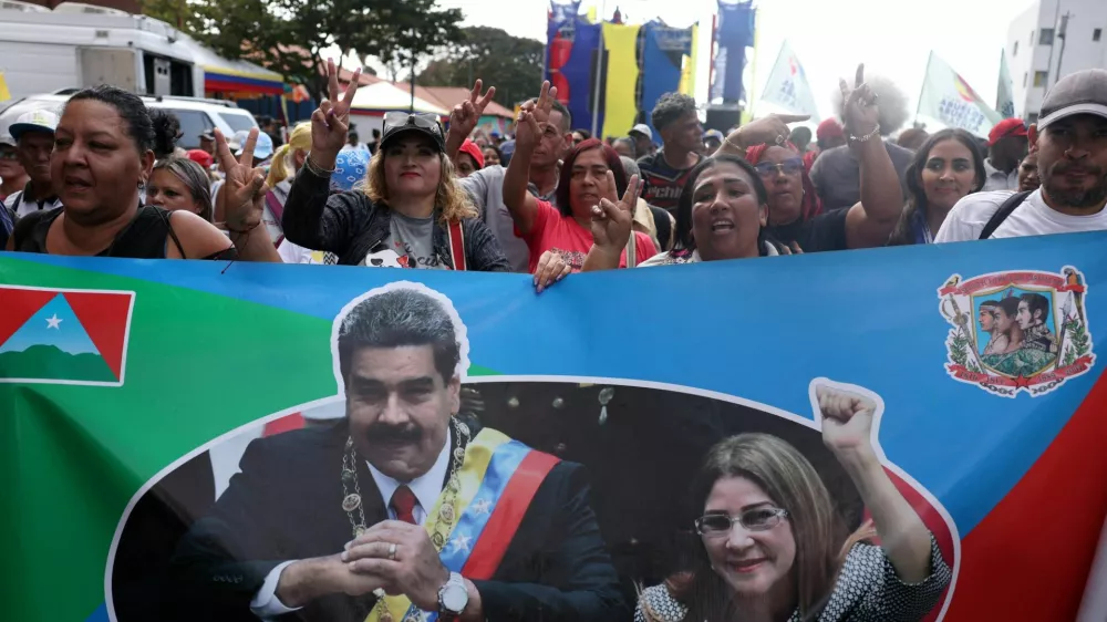 FILE PHOTO: Supporters of Venezuela's government rally to demand the release of ousted President Nicolas Maduro and his wife, Cilia Flores, two months after their capture by the U.S., in Caracas, Venezuela March 3, 2026. REUTERS/Leonardo Fernandez Viloria/File Photo
