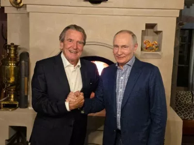 Russian President Vladimir Putin shakes hands with former German Chancellor Gerhard Schroeder during what the Kremlin described as a meeting at Putin's residence on the day of his 74th birthday, at an unidentified location in Russia, in this image released October 8, 2026. Kremlin.ru/Handout via REUTERS ATTENTION EDITORS - THIS IMAGE WAS PROVIDED BY A THIRD PARTY. MANDATORY CREDIT.