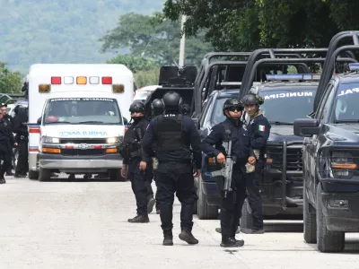 Police officers gather in front of the El Castillo Penitentiary during a riot in Mazatlan, Mexico, Thursday, Oct. 8, 2026. (AP Photo/Fausto Camacho)