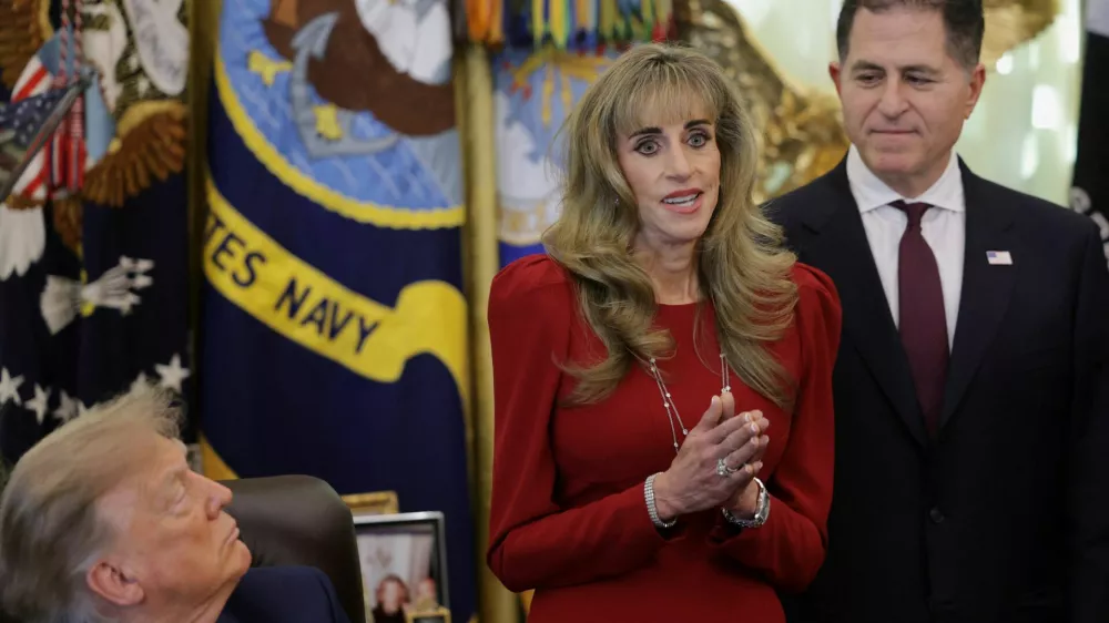 Michael Dell looks on as Susan Dell speaks on the day US President Donald Trump makes an announcement regarding personal investment accounts for children in the Oval Office at the White House in Washington, D.C., US, October 7, 2026. REUTERS/Jonathan Ernst