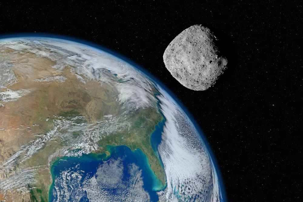 Ilustracija asteroida v bližini Zemlje. Približno taka je bila razdalja tistega dne. / Foto: Istock