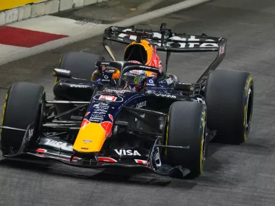 Red Bull driver Max Verstappen of the Netherlands steers his car during the sprint qualifying session ahead of the Singapore Formula One Grand Prix in Singapore, Friday, Oct. 9, 2026. (AP Photo/Vincent Thian)