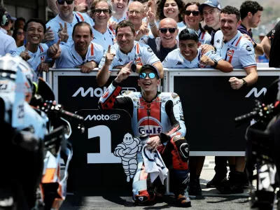 MotoGP - Indonesian Grand Prix - Mandalika International Street Circuit, Mandalika, Indonesia - October 10, 2026 Trackhouse MotoGP Team's Raul Fernandez celebrates with team members after qualifying in pole position REUTERS/Willy Kurniawan