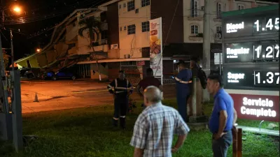 People stand near cars damaged by falling debris after an earthquake struck near the southern coast of Panama, in Penonome, Panama, October 9, 2026. REUTERS/Enea Lebrun