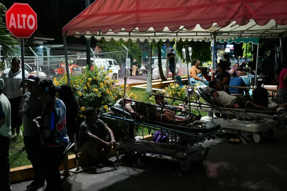 People and patients gather outdoors after being evacuated from Hospital Aquilino Tejeira, after an earthquake struck near the southern coast of Panama, in Penonome, Panama, October 9, 2026. REUTERS/Enea Lebrun  REFILE - UPDATING HEADLINE