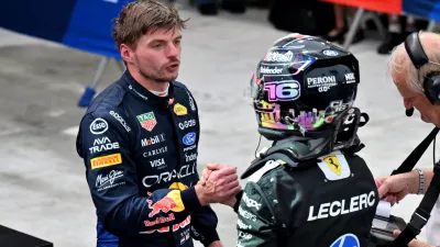 Formula One F1 - Singapore Grand Prix - Marina Bay Street Circuit, Singapore - October 10, 2026 Red Bull's Max Verstappen shakes hands with third placed Ferrari's Charles Leclerc after winning the sprint race REUTERS/Caroline Chia