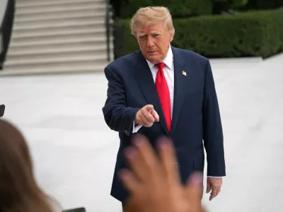 President Donald Trump speaks to members of the media before departing on Marine One from the South Lawn of the White House, Saturday, October 10, 2026, in Washington. (AP Photo/Nathan Howard)