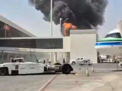 This image from video obtained and verified by AP shows thick black smoke and flames rising from a fire at King Khalid International Airport in Riyadh, Saudi Arabia, Friday, Oct. 9, 2026. (UGC via AP)