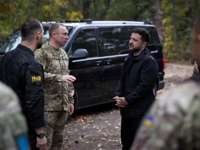 Ukraine's President Volodymyr Zelenskiy, Commander-in-Chief of the Ukrainian Armed Forces Major General Mykhailo Drapatyi and Ukrainian Defence Minister Yevhenii Khmara talk as they visit service members of the 66th Separate Mechanized Brigade named after Prince Mstyslav the Brave, amid Russia's attack on Ukraine, near the front line in Donetsk region, Ukraine, September 30, 2026. Ukrainian Presidential Press Service/Handout via REUTERS ATTENTION EDITORS - THIS IMAGE HAS BEEN SUPPLIED BY A THIRD PARTY. REFILE - QUALITY REPEAT
