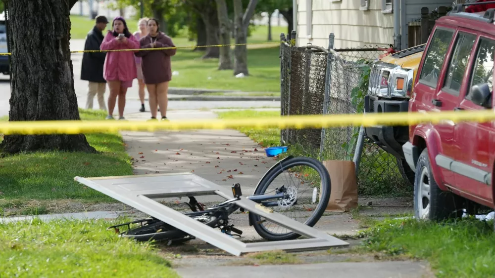 Bystanders gather near a house where nine people were confirmed dead in what was described as a mass shooting in Erie, Pennsylvania, U.S. October 10, 2026. Greg Wohlford/USA Today via REUTERS.  THIS IMAGE HAS BEEN SUPPLIED BY A THIRD PARTY. NO RESALES. NO ARCHIVES