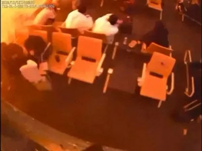 Surveillance footage shows people sitting in a waiting area reacting at the moment of an attack, in a location given as King Khalid International Airport in Riyadh, Saudi Arabia, October 10, 2026, in this frame from a handout video. Saudi Ministry of Media/Handout via REUTERS  THIS IMAGE HAS BEEN SUPPLIED BY A THIRD PARTY. OVERLAY FROM SOURCE. VERIFICATION: Reuters verified the location from the CCTV of the boarding gate from the infrastructure and furniture that matched the archive and satellite imagery from terminal 3 at King Khalid International Airport. The location of the CCTV that showed the people seated was not verified. The date the video was filmed was confirmed with the timestamp on the surveillance footage. The Saudi Civil Aviation Authority said the airport operations were suspended after an attack that left many injured on October 10. No old results were found posted online before October 11.